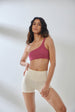 Aero Set Malaga Pink One Shoulder Top and Vanilla White Hot Shorts